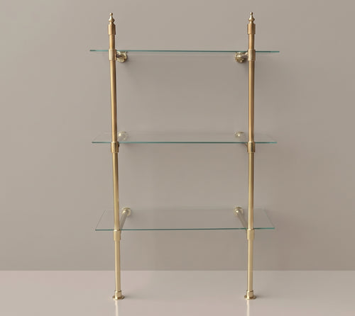 Front view of the two-post solid brass shelf with finial tops and three glass shelves