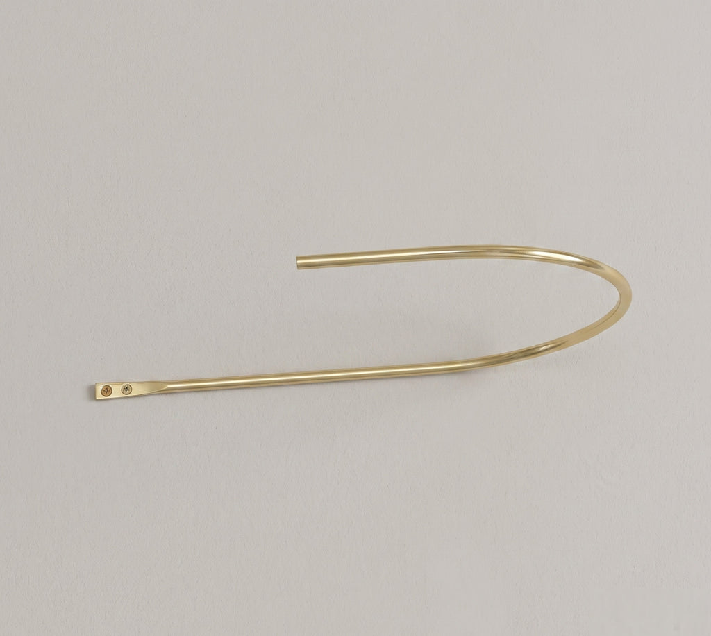 Solid brass crescent tieback for curtains, unlacquered finish that develops a natural patina