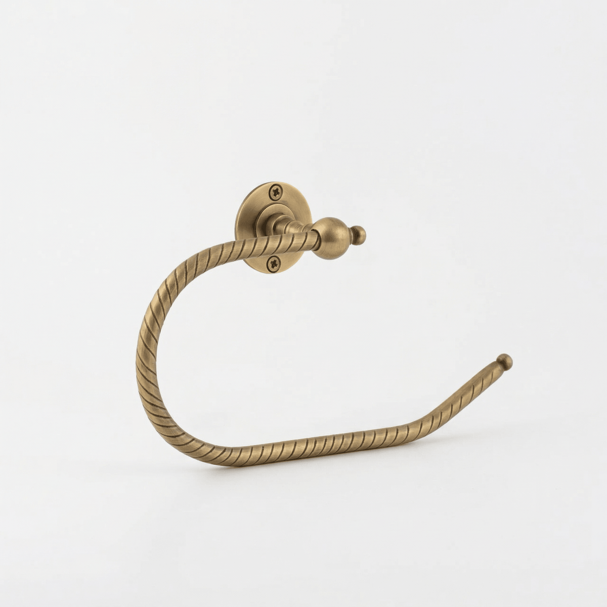 Open brass toilet roll holder with hand-engraved pattern